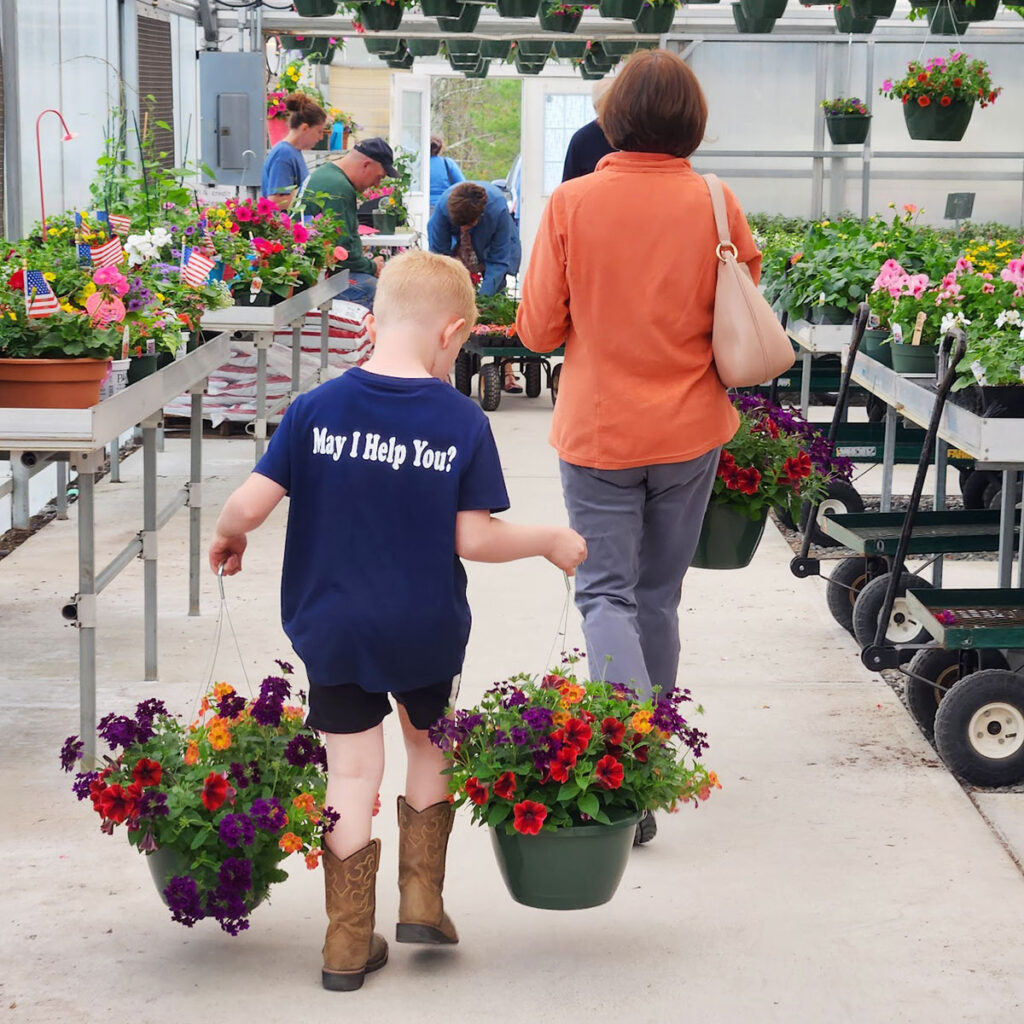 Hubbard's Greenhouse, farm boy helping